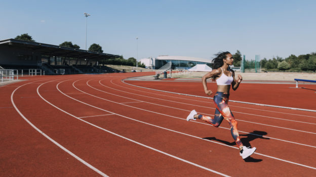 Woman running on a running track