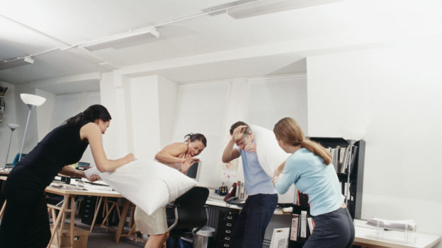 People having a pillow fight