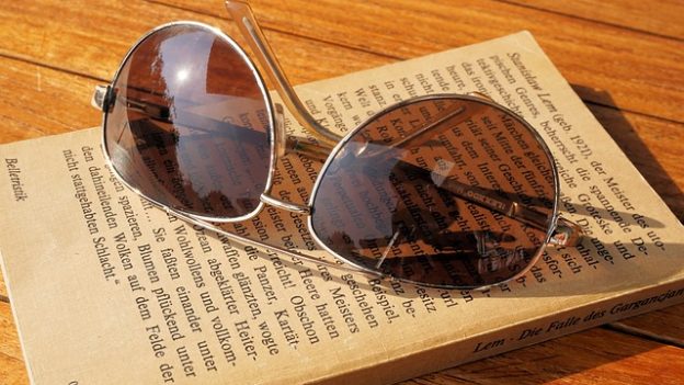 Sunglasses and a book