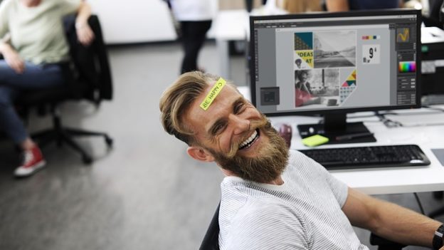 Office worker with post-it-note on head