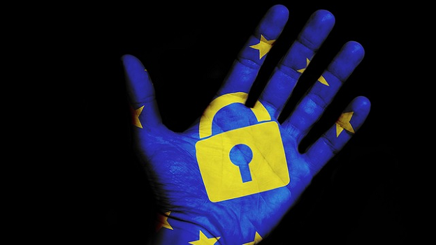 GDPR Blue hand covered in EU print and padlock