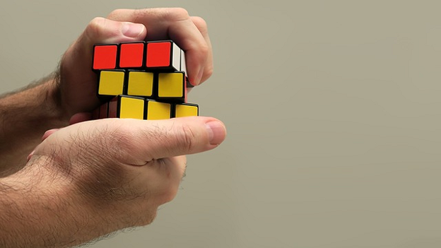 Person solving a rubix cube