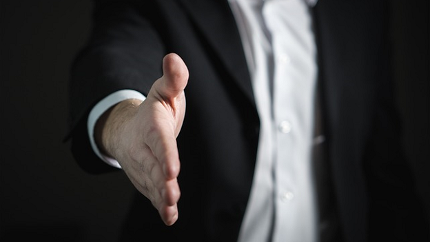 Outstretched shaking hand