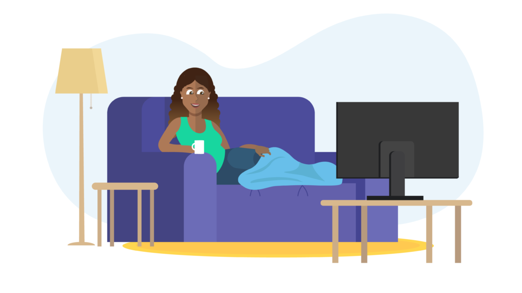 Woman sitting on sofa watching TV image